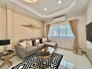 Elegant living room with modern decor and plush furnishings