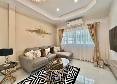 Elegant living room with modern decor and plush furnishings