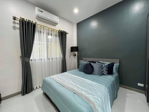 Modern bedroom with stylish decor and air conditioning