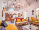 Spacious and bright living room with high ceiling and eclectic decor