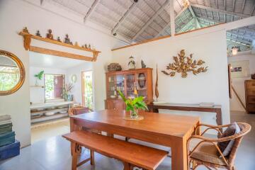 Spacious and well-decorated living room with wooden furnishings