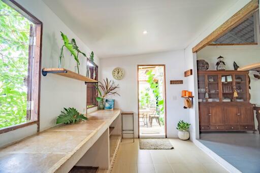 Bright and airy kitchen with natural light and wooden furniture