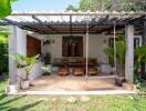 Cozy outdoor patio with comfortable seating and lush greenery