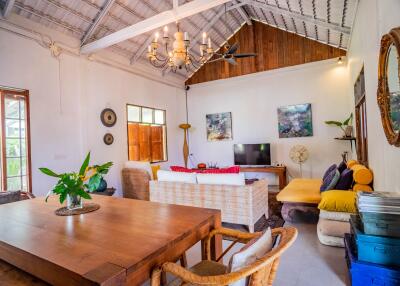 Spacious and elegantly decorated living room with high ceilings and natural light