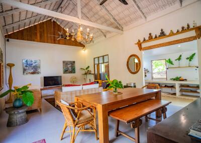 Spacious living room with high ceiling and rustic decor