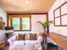 Cozy and bright living room with natural wood accents and garden view