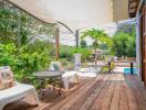 Spacious and lush garden patio with comfortable seating and natural shade