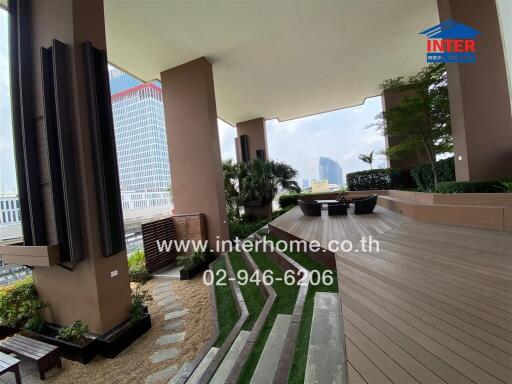 Spacious covered patio area with modern outdoor furniture and city skyline view