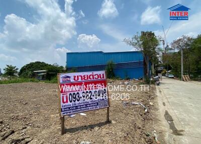 Real estate advertising sign in front of a commercial property