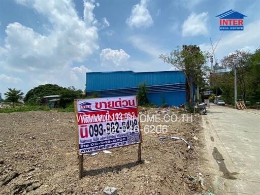 Real estate advertising sign in front of a commercial property