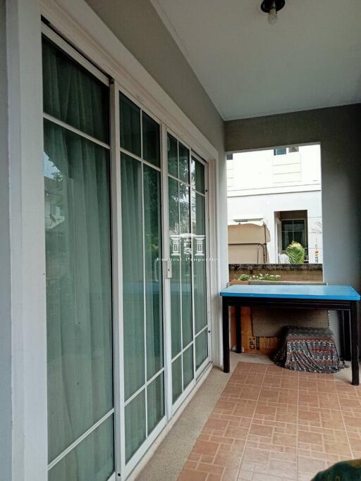 Spacious covered patio with large sliding doors and a built-in sink area