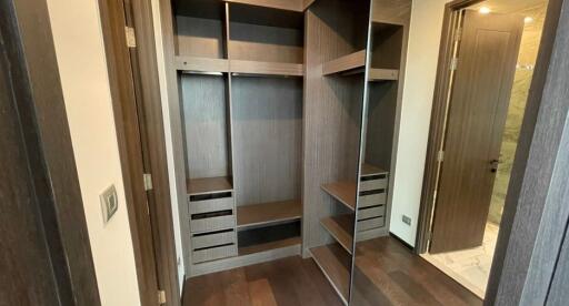 Spacious bedroom closet with organizational shelving