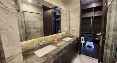 Elegant modern bathroom with dual sinks and marble finishes