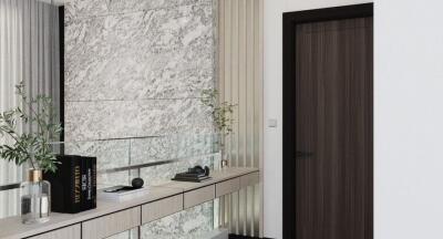 Elegant modern hallway with marble wall and sleek storage console