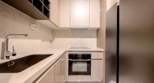 Modern kitchen with under-cabinet lighting and built-in appliances