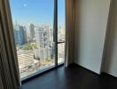 Spacious bedroom overlooking cityscape through large window