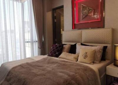 Elegantly decorated bedroom with plush bedding and modern decor