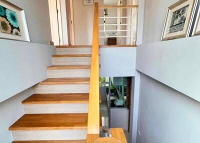 Modern wooden staircase in a well-lit home interior