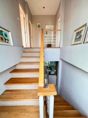 Modern wooden staircase in a well-lit home interior