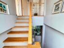 Modern wooden staircase in a well-lit home interior