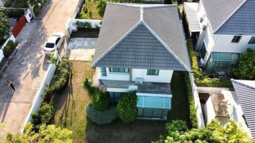 Aerial view of a modern residential house with garden