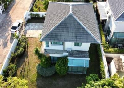 Aerial view of a modern residential house with garden