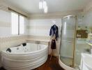 Spacious bathroom with jacuzzi tub and separate shower