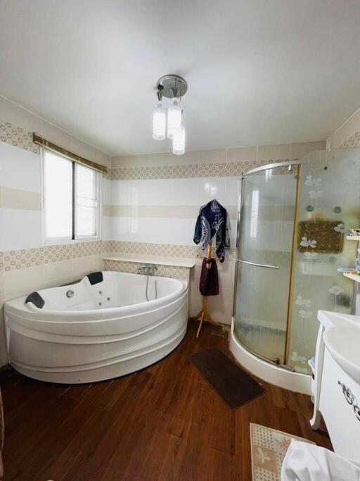 Spacious bathroom with jacuzzi tub and separate shower