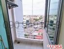 Bright and airy city view balcony with tiled flooring and safety railing