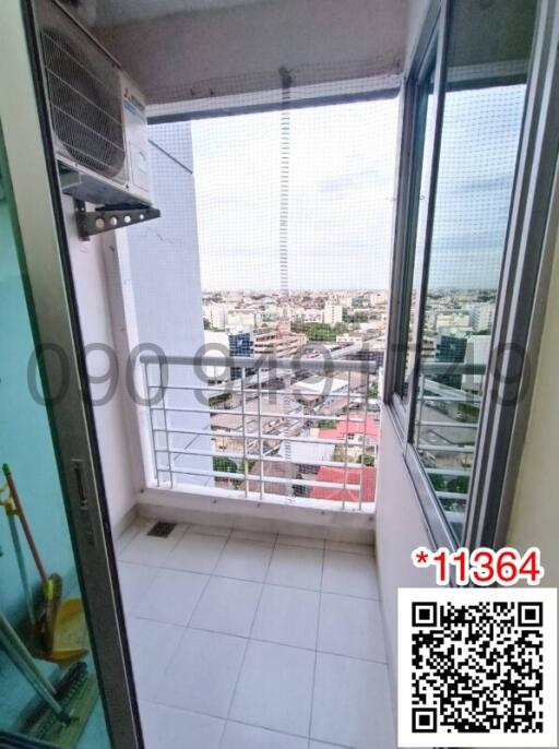 Bright and airy city view balcony with tiled flooring and safety railing