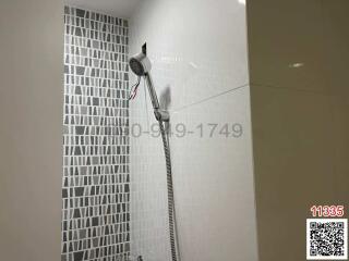 Modern bathroom interior with tiled walls and shower