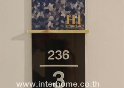 Apartment mailbox with number 236 and real estate branding