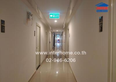 Long indoor hallway in a residential building