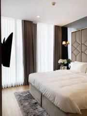 Modern bedroom with large bed and stylish decor