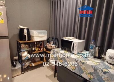 Compact and fully equipped modern kitchen with appliances