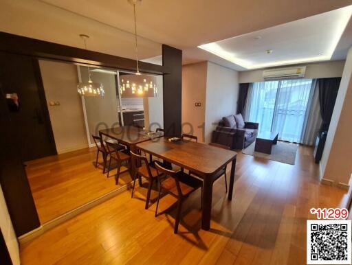 Spacious living room with dining area and elegant lighting