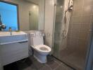 Modern bathroom with glass shower and tiled flooring