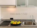 Modern kitchen with granite countertop and stainless steel sink