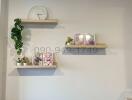 Bright and stylish living room wall with decorative shelves