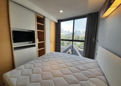 Spacious Bedroom with Large Window and City View