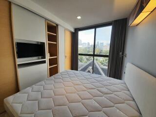 Spacious Bedroom with Large Window and City View