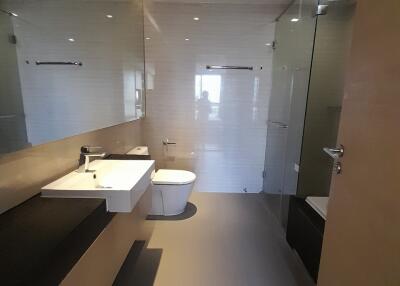 Modern bathroom with sleek design featuring a walk-in shower and double vanity