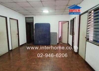 Spacious hallway with multiple doors and natural light