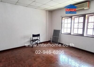 Spacious unfurnished room with large windows