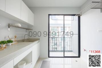 Modern kitchen with large window and minimalist design
