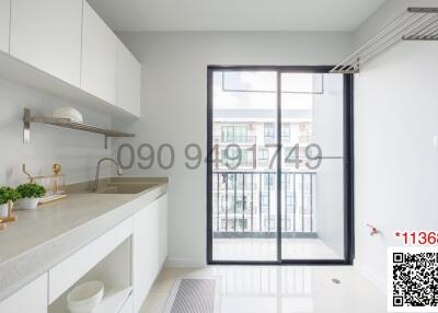 Modern kitchen with large window and minimalist design
