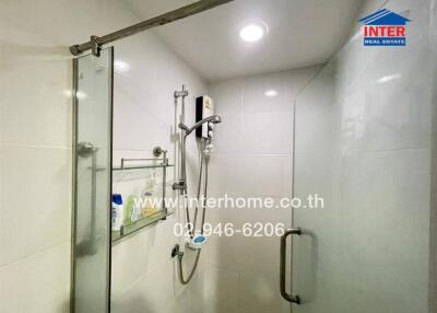 Modern bathroom interior with glass shower and white tiles