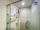 Modern bathroom interior with glass shower and white tiles