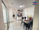 Modern kitchen with dining area and well-organized shelves