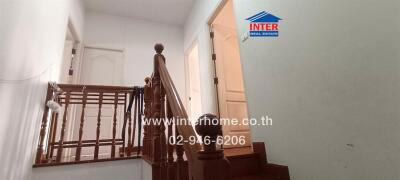 Elegant wooden staircase in bright interior